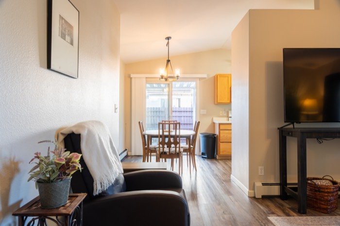 View from the living room through to the dining area of a residential listing