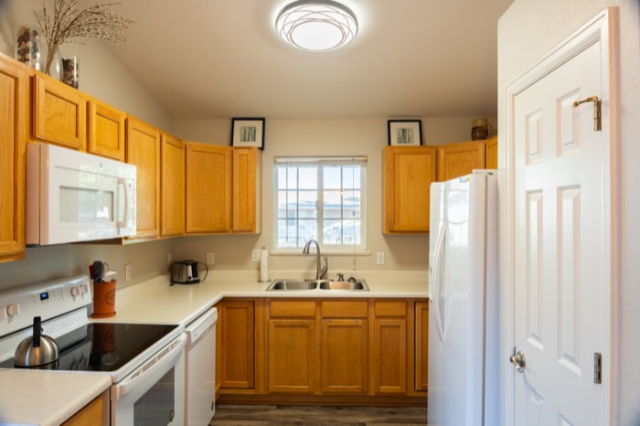 Kitchen of a Colorado residential listing with window light